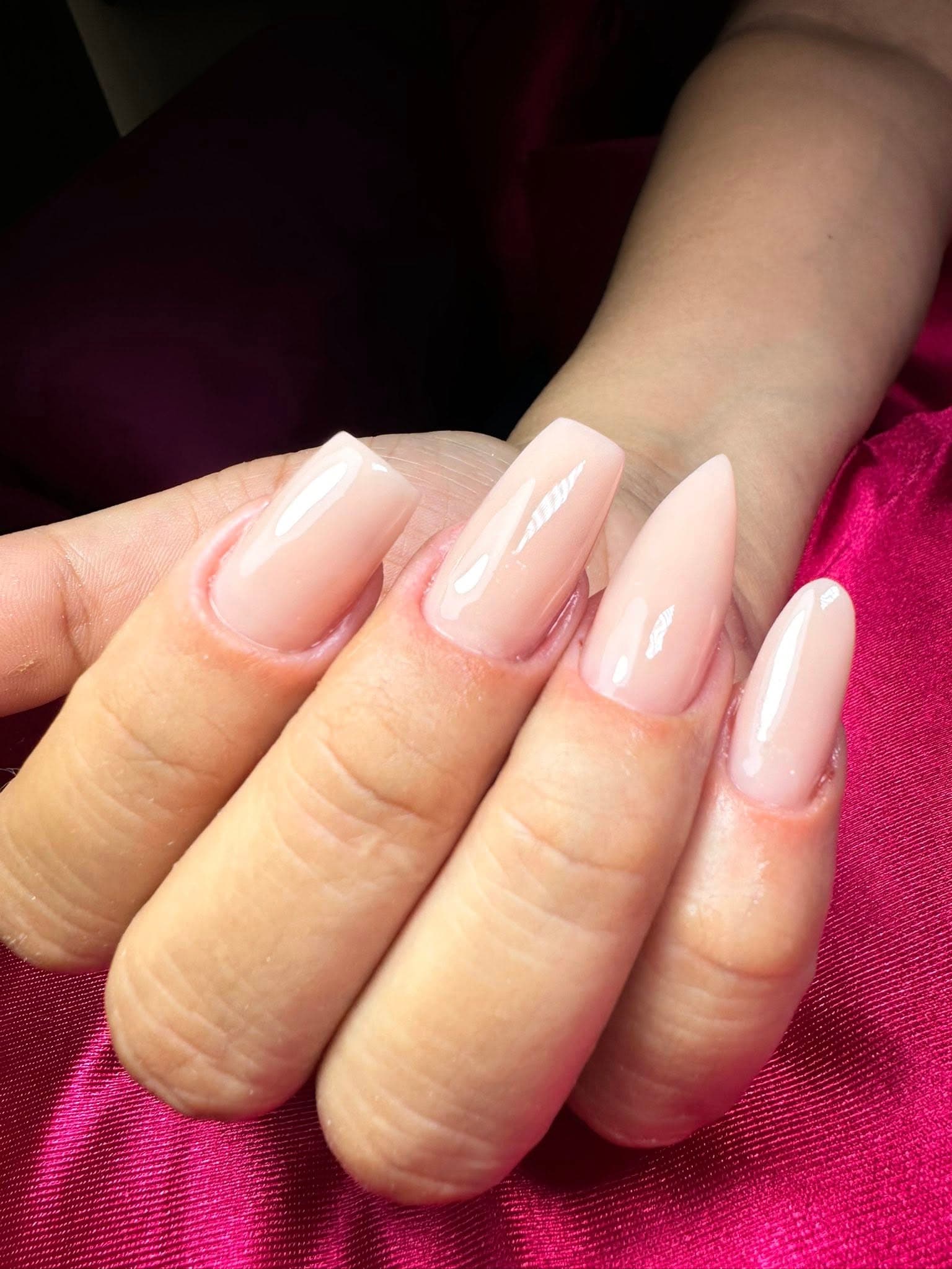 Natural pink nude coffin nails with a glossy finish