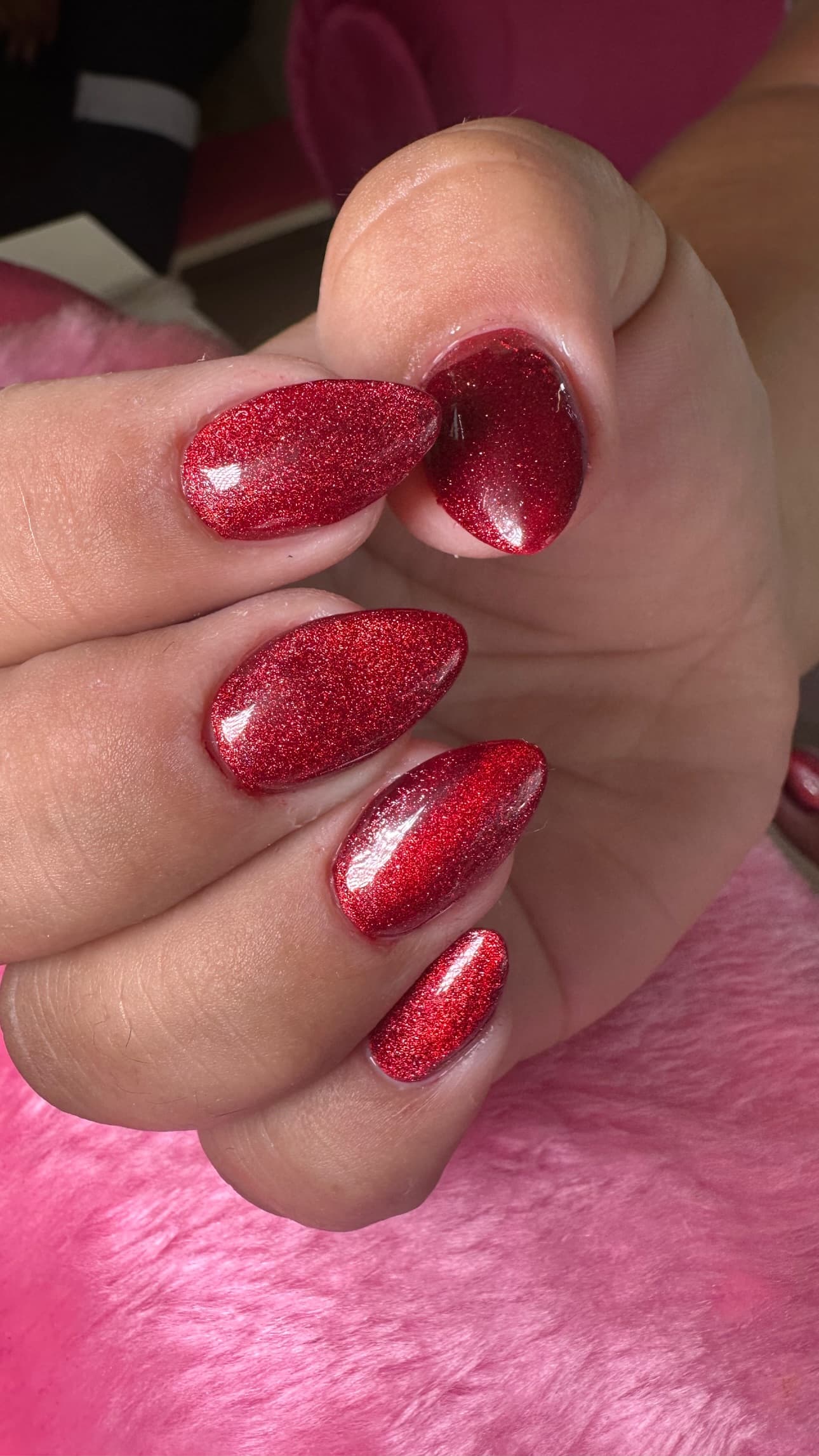 Square red nails fully covered with holographic glitter